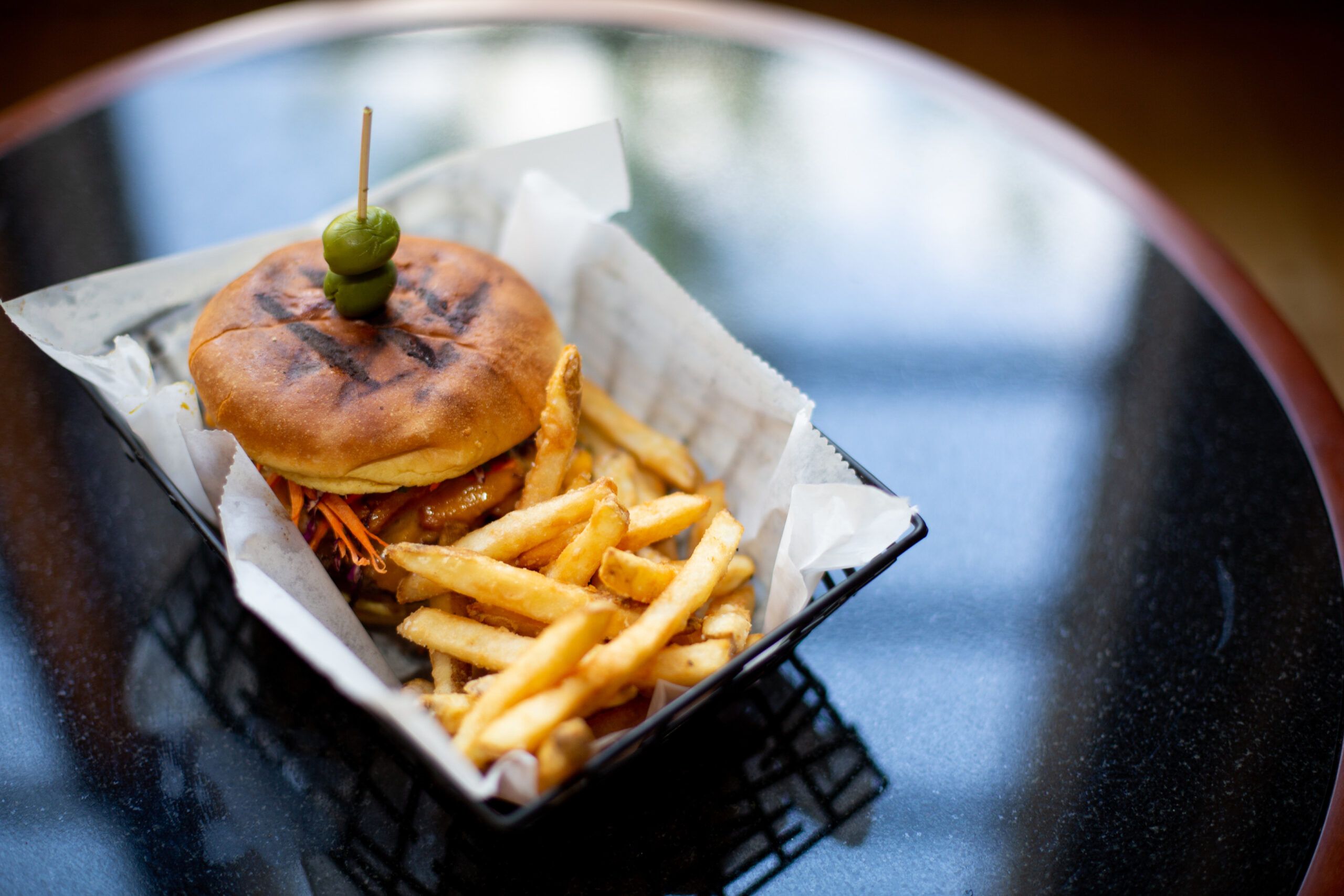 A cheeseburger with a side of fries.