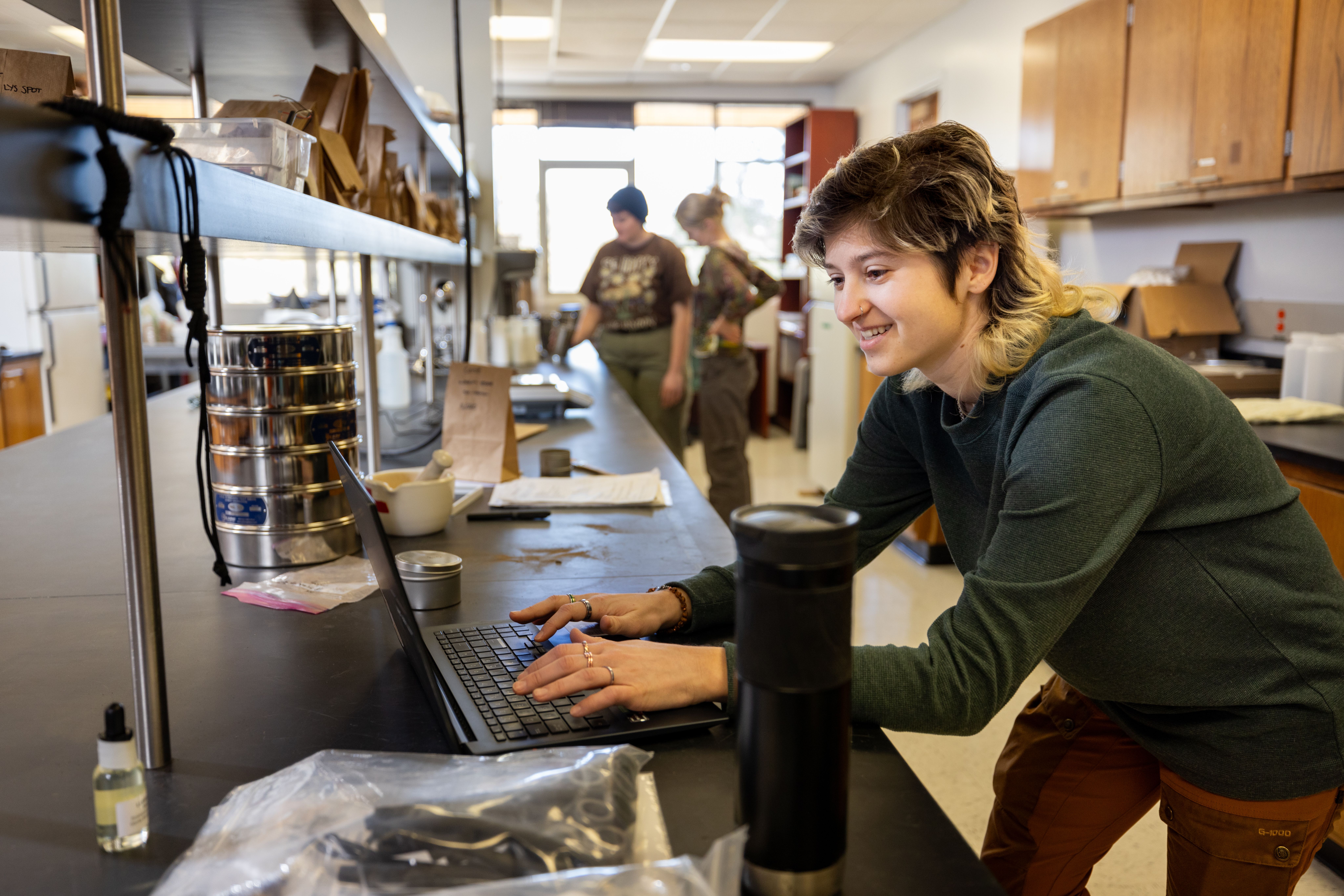 An NAU Forestry student tests soil samples in the Flagstaff campus research lab.