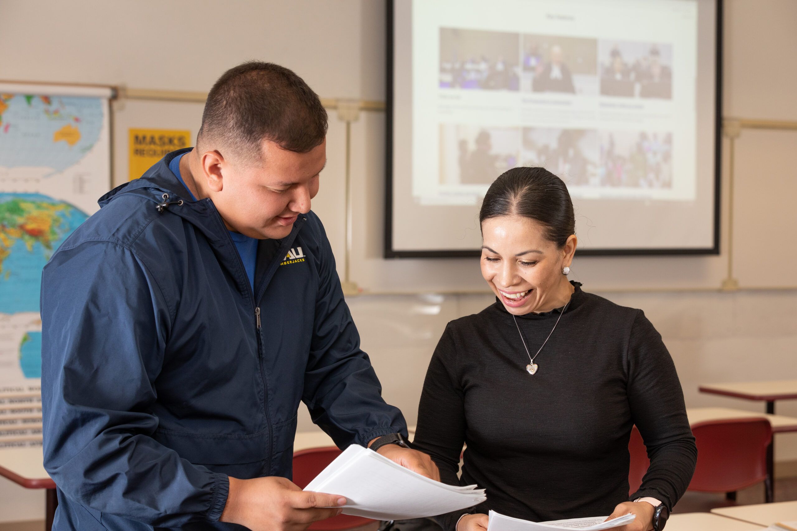 NAU Yuma Criminal Justice students happily discuss their work in class.