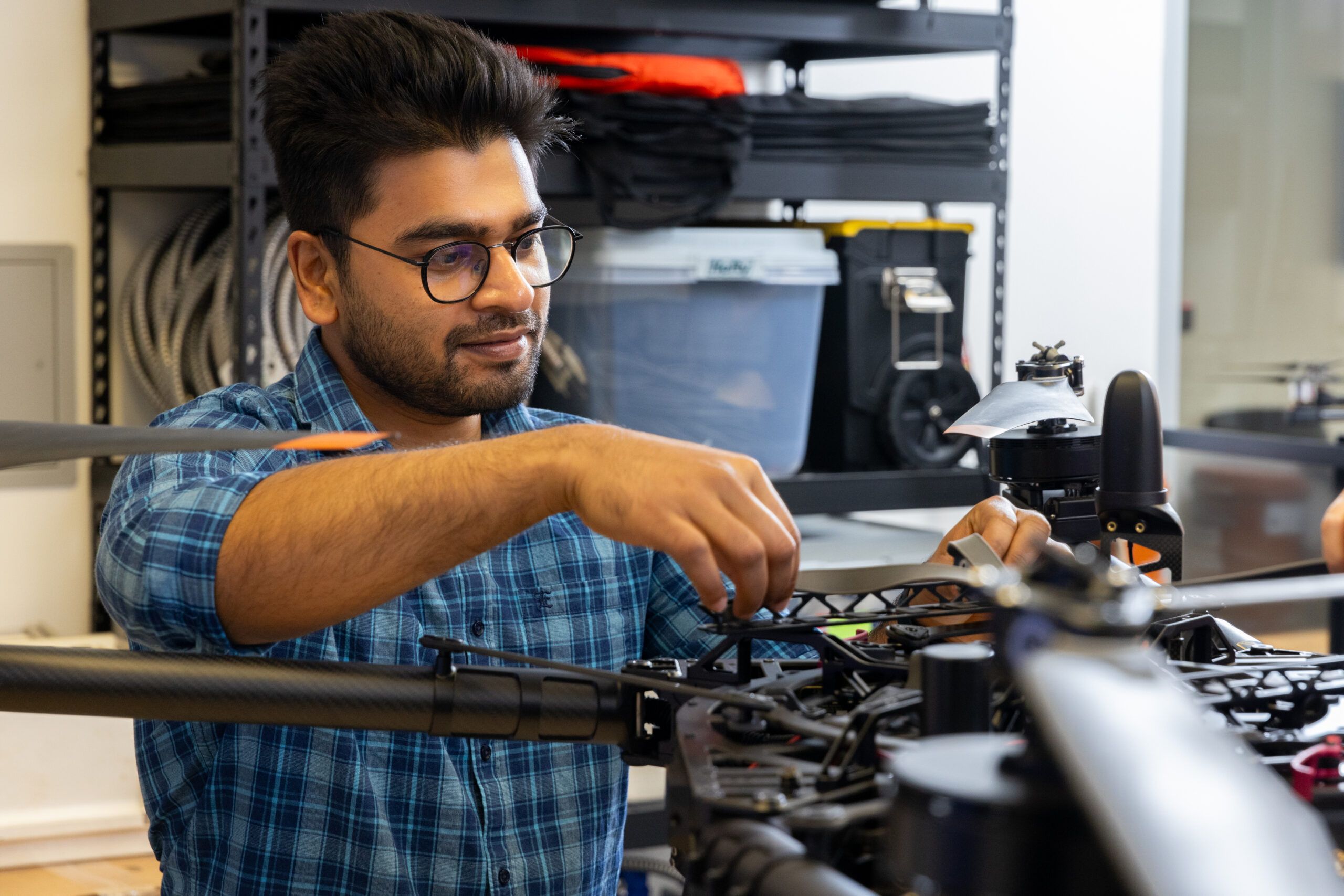 An NAU mechanical engineering student works on a project on campus.